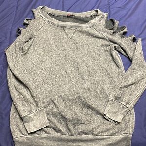 Stylish grey crew neck with cut outs on the shoulders